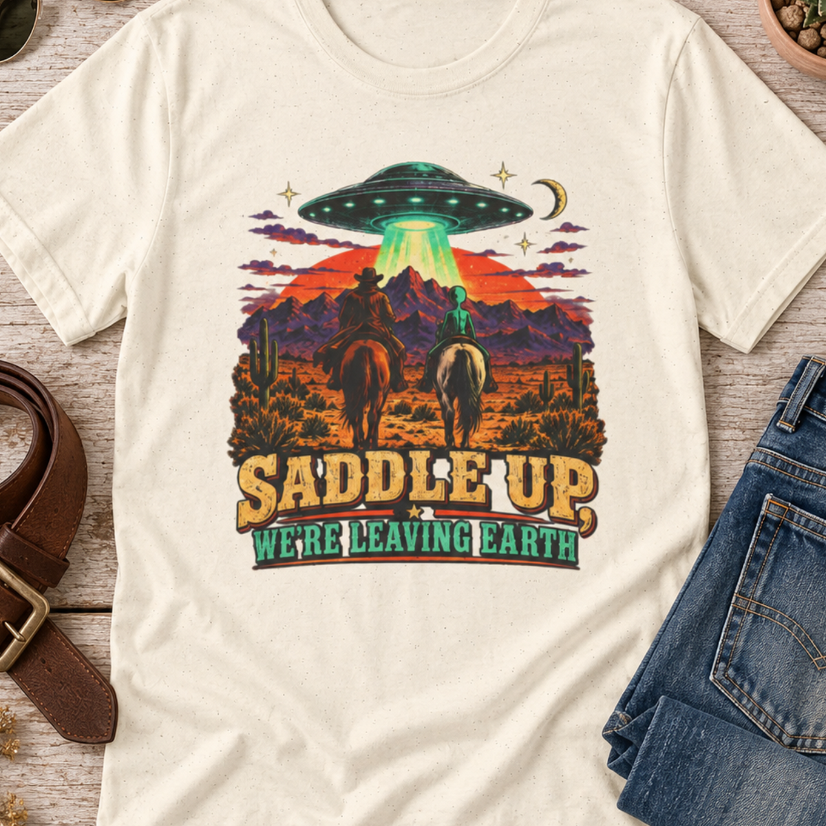 “Saddle Up We’re Leaving Earth” Retro Western Alien Tee